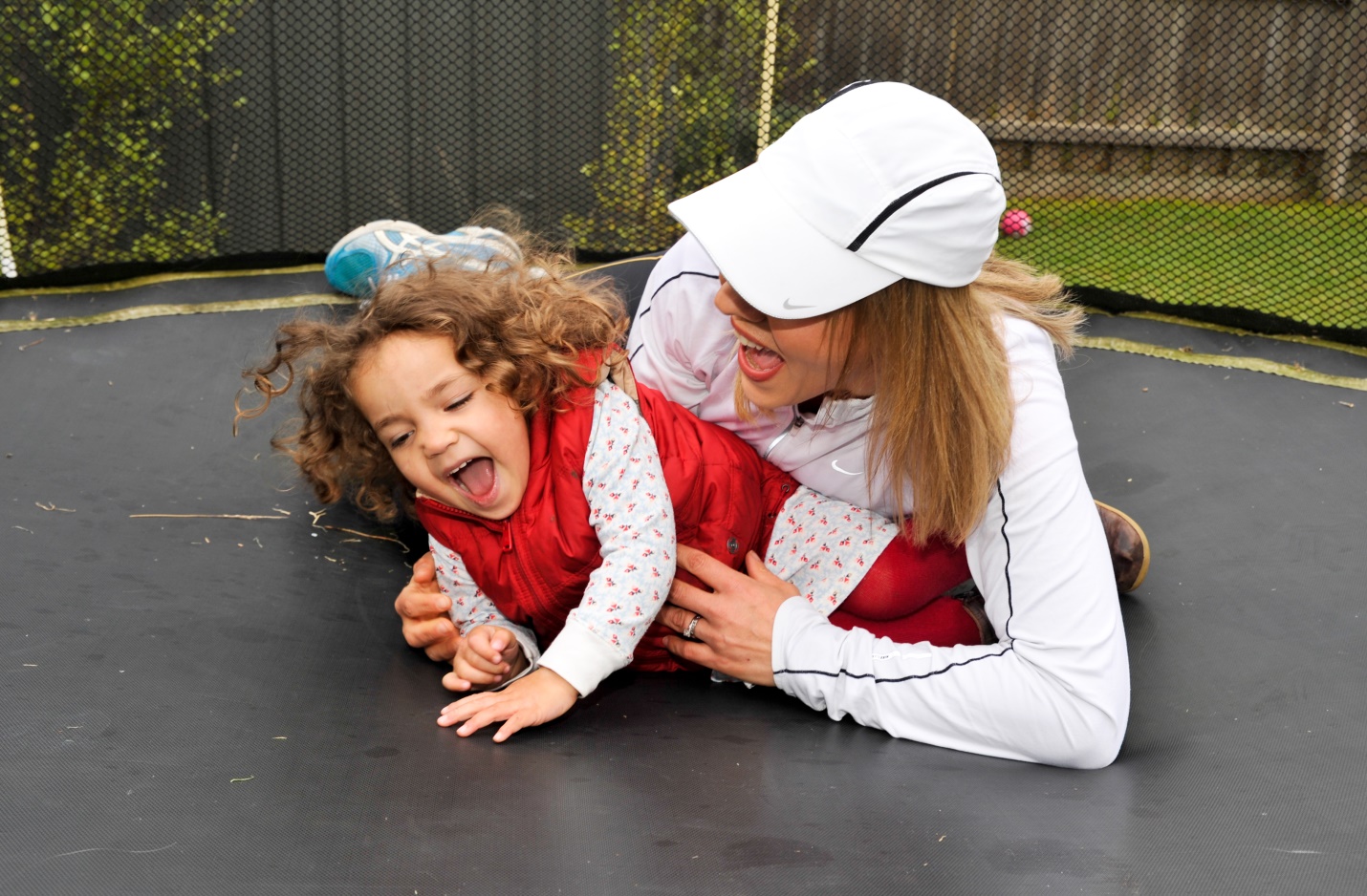 Adult and child on trampoline