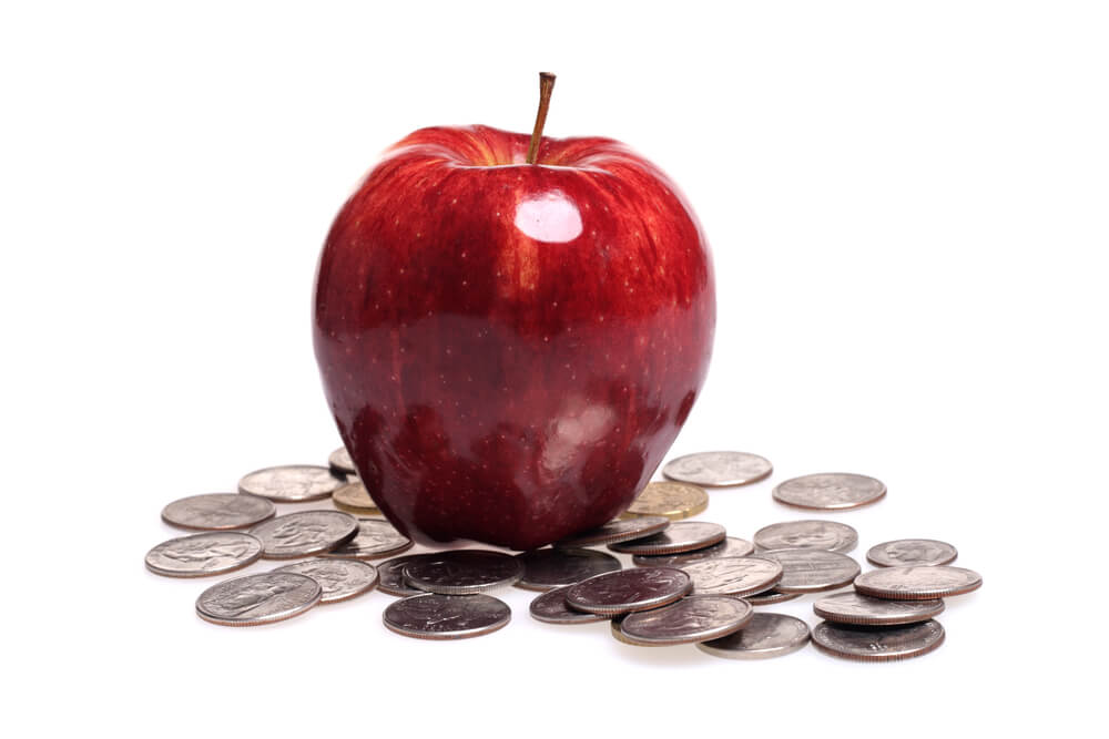 apple in pile of coins